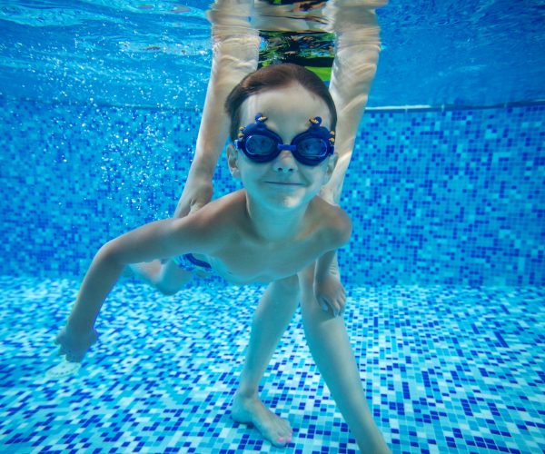 young-boy-swimming-underwater.jpg
